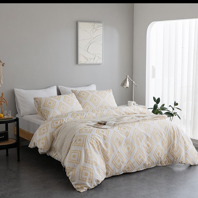 Parure de lit blanc à forme géométrique dorée